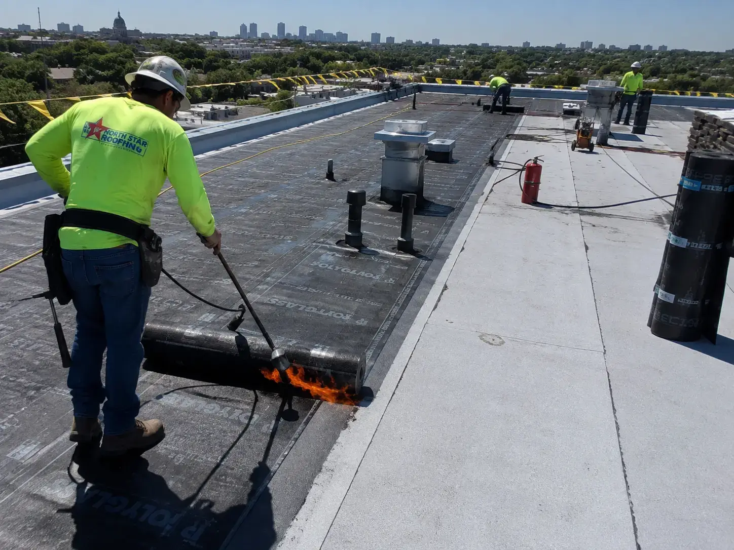 Commercial roofing crew working in Orange County